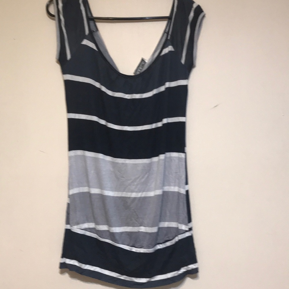 Used. Open in the back shirt/ top.